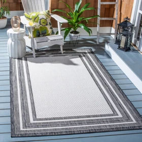 SAFAVIEH Outdoor CY8475-53712 Courtyard Ivory / Black Rug SAFAVIEH Outdoor CY8475-53712 Courtyard Ivory / Black Rug
